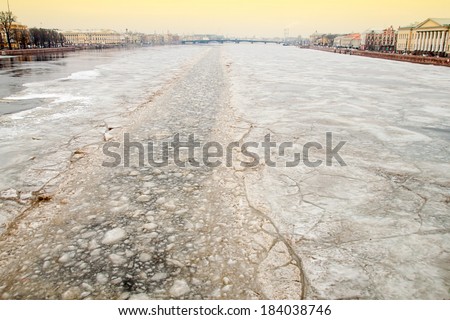 Ice-breaking tug opens the way across the frozen Neva river in a direction of the Palace Bridge. St.-Petersburg. Russia