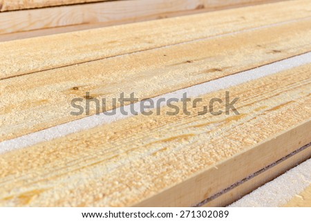 Wooden board for terrace, stacked at construction site