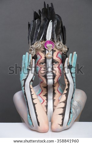 beauty girl portrait art in the way with ethnic elements on a gray background