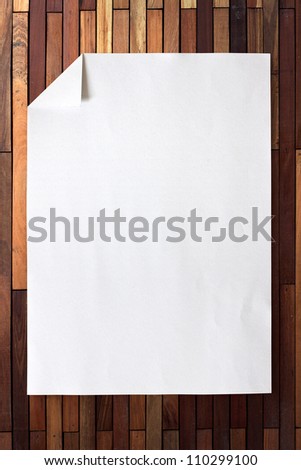 Full page of White paper folded on wood background with shadow