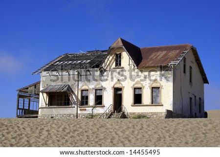 Old broken house in the ghost diamond mining town of Kolmanskop, Namibia, Africa
