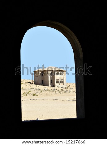 Ghost town house at Kolmanskop, Namibia, from within another ghost house window