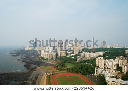 Aerial shot of Mumbai\'s afluent Napean Sea area with Arabian sea during day. Here most of super rich billionares and millionares stay in high-rise towers. Copy space.