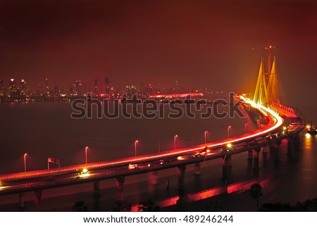 Illuminated Bandra-Worli Sealink, officially called Rajiv Gandhi Sea Link at night. It is a cable-stayed vehicular bridge that links Bandra in the northern suburb of Mumbai with Worli in South Mumbai