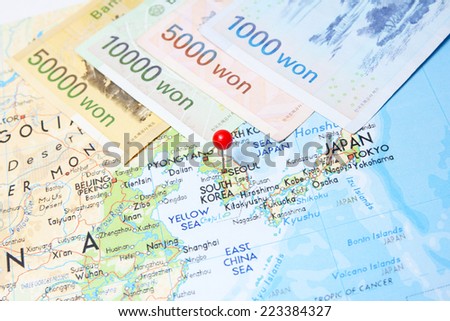 South Korean Won currency with pin on Korea on map