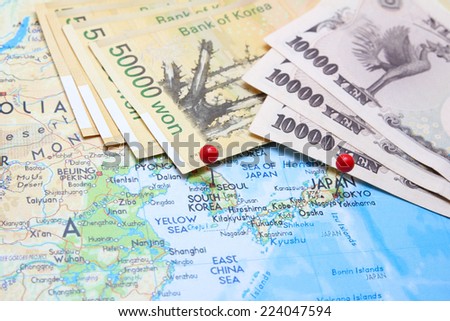 South Korean Won and Japanese Yen with pin on map