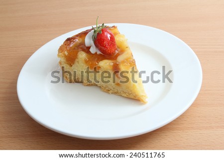 Slice of mango cake on plate