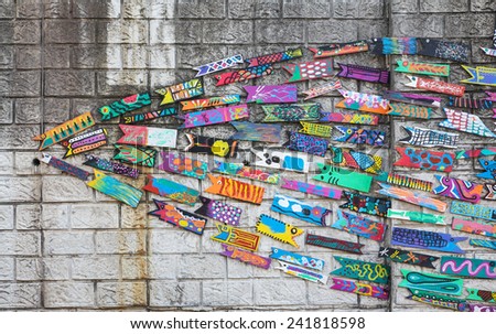 BUSAN, KOREA - OCTOBER 24, 2014 : Wall art made of painted wooden fish in Busan Culture Village in Busan, Korea.