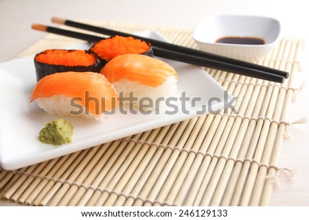 Salmon and flying fish roe sushi on plate