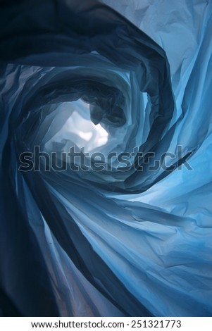 Space warp - Abstract background of the insides of a blue plastic bag with different color shades