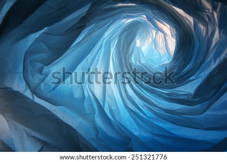 Space warp - Abstract background of the insides of a blue plastic bag with different color shades