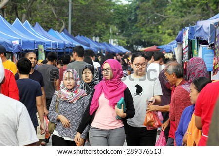 KUALA LUMPUR, MALAYSIA : JUNE 20, 2015 - Crowd buying food at a ramadhan bazaar before breaking fast during the fasting month of ramadhan.