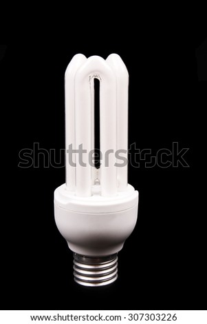 Energy efficient light bulb on black background