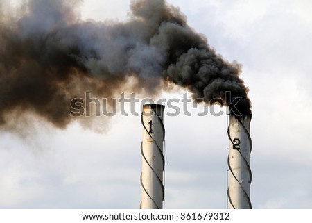Black smoke emission from industrial chimney stacks