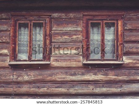Close up of square  windows in old  wooden house
