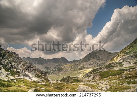 Stormy landscape with clouds in Retezat mountains, Romania