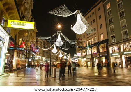 VIENNA, AUSTRIA - December 11, 2009: Vienna - tourists on famous Graben street at night with Christmas chandeliers in Vienna, Austria. on December 11, 2009