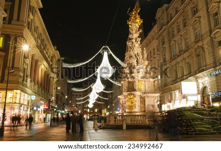 VIENNA, AUSTRIA - December 11, 2009: Vienna - tourists on famous Graben street at night with Christmas chandeliers in Vienna, Austria. on December 11, 2009