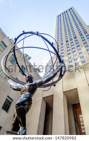 NEW YORK - CIRCA MAY 2013:: The historic Atlas Statue in the Rockefeller Center, New York, circa May 2013. It stands for power in the 5thAve where is located the most expensive stores of Manhattan,NYC