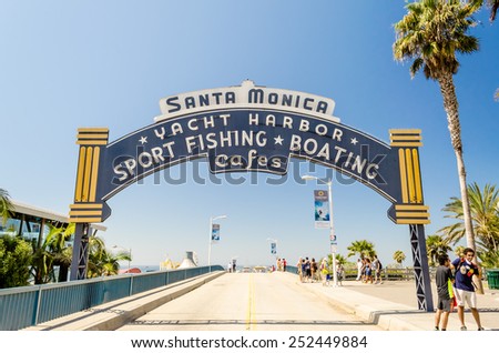 SANTA MONICA, CALIFORNIA - AUGUST 29: The welcoming arch of Santa Monica Pier on August 29, 2012. The site is an iconic 100-year-old landmark for California visitors.