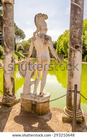 Greek Statue of Ares overlooking the ancient pool called Canopus, inside Villa Adriana (Hadrian\'s Villa), Tivoli, Italy