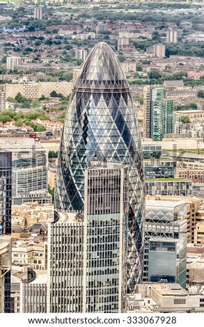 LONDON - MAY 29: The Gherkin building (30 St Mary Axe) in London on May 29, 2015. Iconic landmark of London, this is one of the city\'s most widely recognized examples of modern architecture.