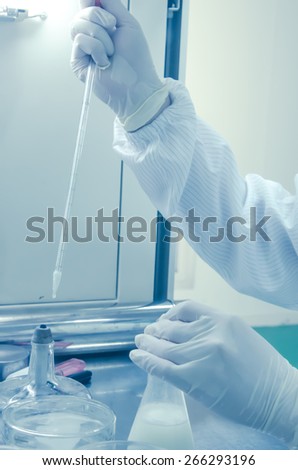 a  researcher doing research in a lab,science test background