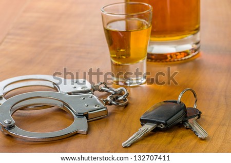 Shot Glass With Car Keys And Handcuffs
