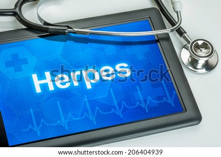 Tablet with the diagnosis Herpes on the display