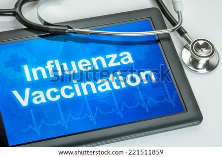 Tablet with the text Influenza Vaccination on the display