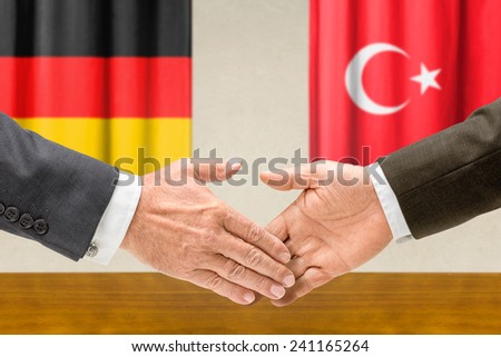 Representatives of Germany and Turkey shake hands