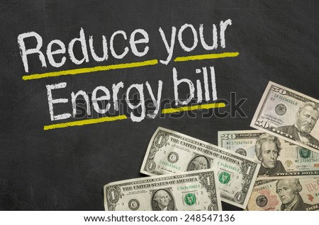 Text on blackboard with money - Reduce your energy bill