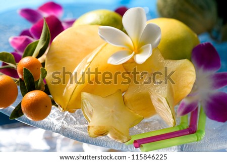 Exotic tropical fruits with tropical flowers still life. Hawaii, Maui, USA