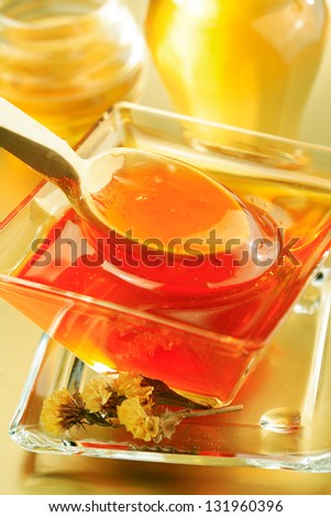 Honey  bowl  and a honey jar with a spoon