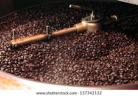 Freshly roasted coffee beans   in a coffee roaster