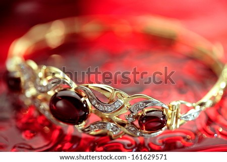 Jewelry bracelet on red background