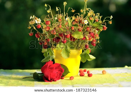 Fresh ripe strawberries bouquet in a vase