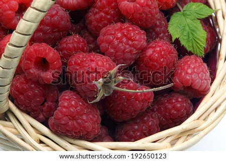 Basket of freshly picked raspberries, top view