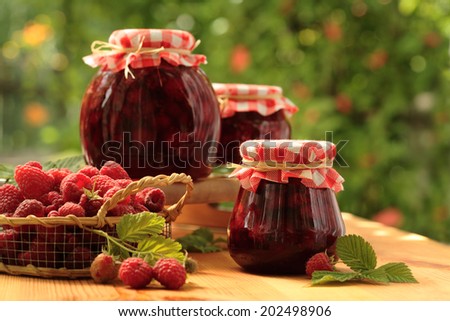 Raspberry jam jar and fresh raspberries/ preserving raspberries
