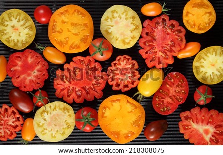 Beefsteak tomatoes on black background