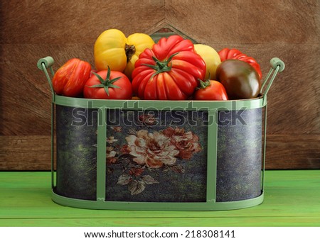 Container of beefsteak tomatoes and cherry tomatoes