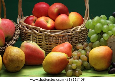 Red wine grapes, white wine grapes, red apples and pears   baskets