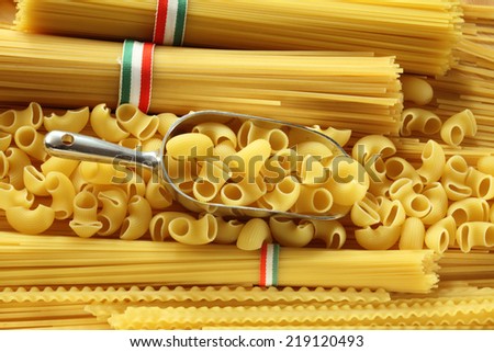Uncooked pasta variety: spaghetti bunches with Italian flag ribbon