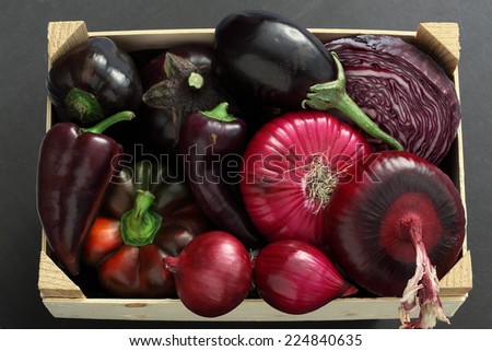 Purple vegetables box:  eggplant, red onion, red cabbage head, radicchio, purple bell pepper, basil
