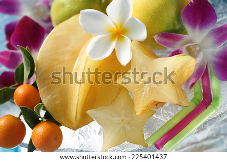 Exotic tropical fruits with tropical flowers still life. Hawaii, Maui, USA