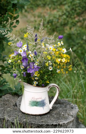 Field flowers bouquet in a vase