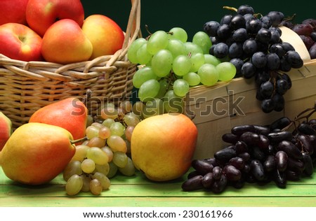 Red wine grapes, white wine grapes, red apples and pears   baskets