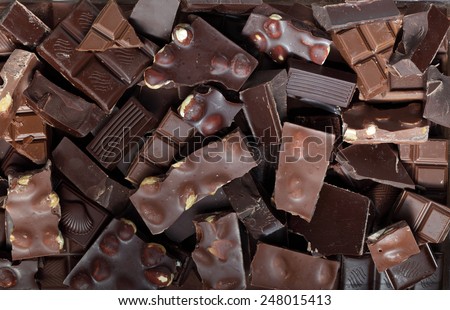 Mix of chocolate bar pieces made of dark chocolate, milk chocolate, white chocolate