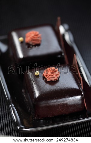 Chocolate mousse  cake dessert on black plate