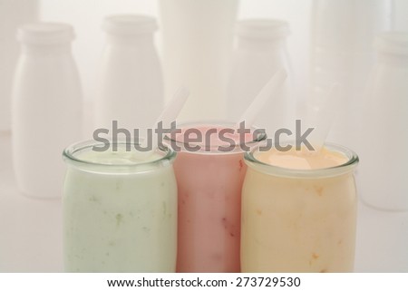 Homemade live fruit yogurt pots/ yogurt jar   isolated on white background